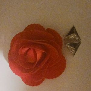 Black and silver small triangle shaped earring.